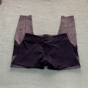 Woman’s purple and plum colored leggings